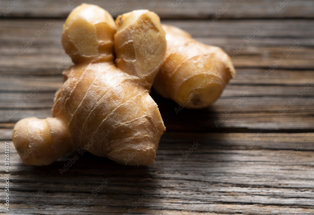 Ginger placed on an old wooden background. Ginger placed on an old wooden background.