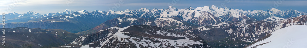 Panoramic mountain view. Snow-capped peaks and glaciers.