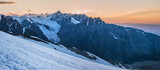 Morning in the mountains, snow-capped peaks. Panoramic view.