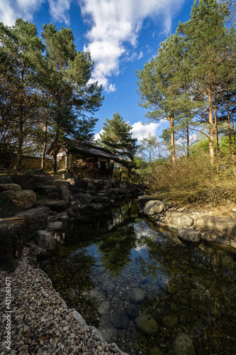 Traditional Korean house surrounded by nature.