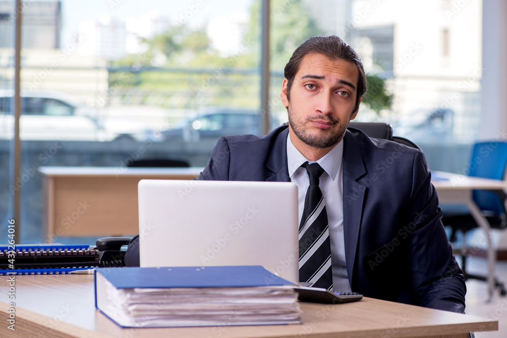 Young businessman employee working in the office Young businessman employee working in the office