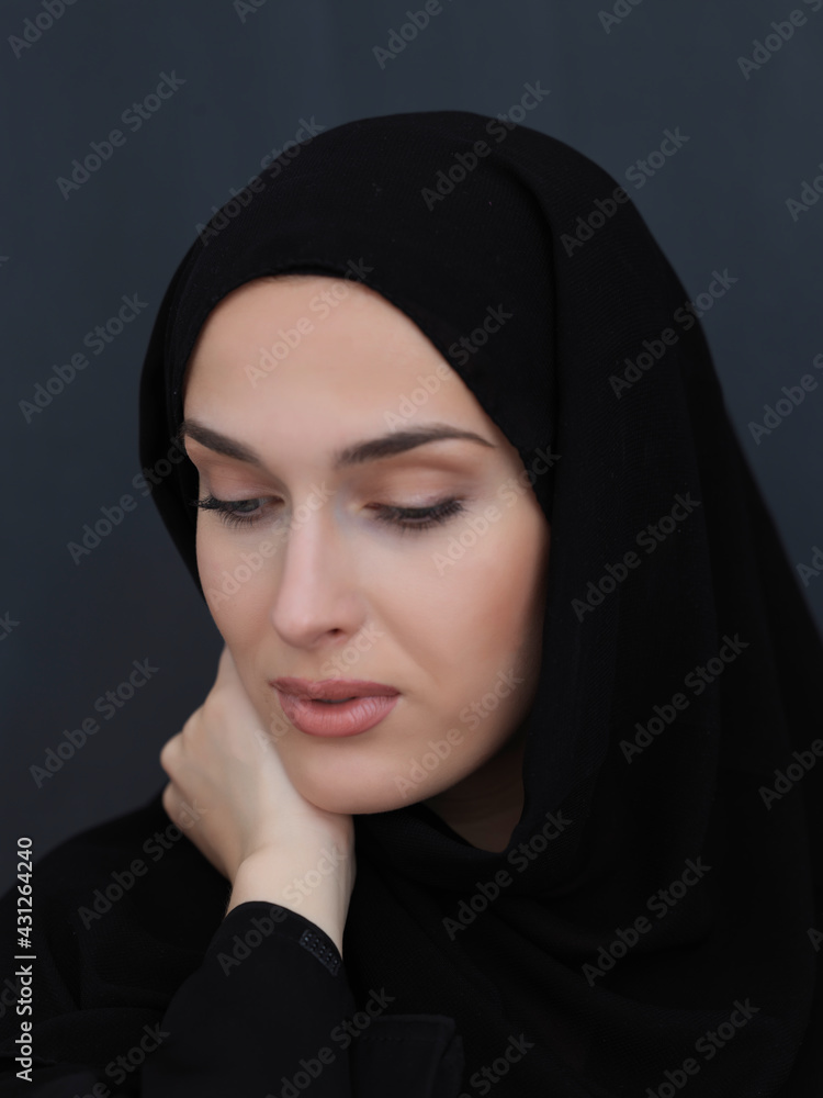 Portrait of modern young muslim woman in black abaya Portrait of modern young muslim woman in black abaya