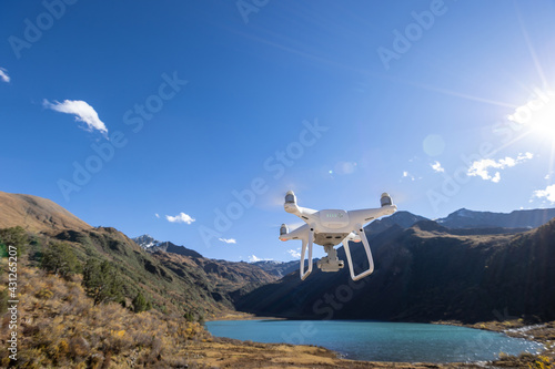 Flying drone taking photo of  landscape in China