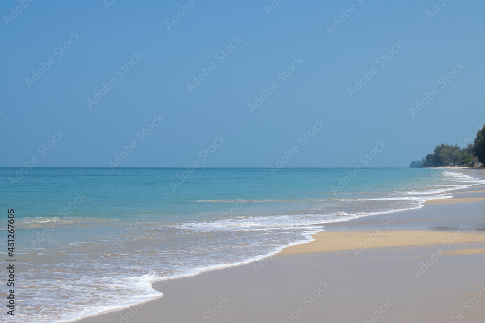 Beautiful beach and blue sky on a sunny day. Background for summer vacation.