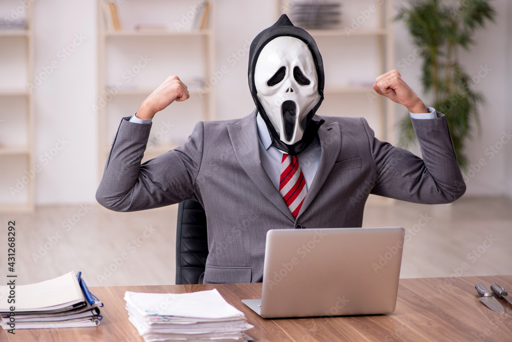 Devil businessman employee sitting at workplace Devil businessman employee sitting at workplace