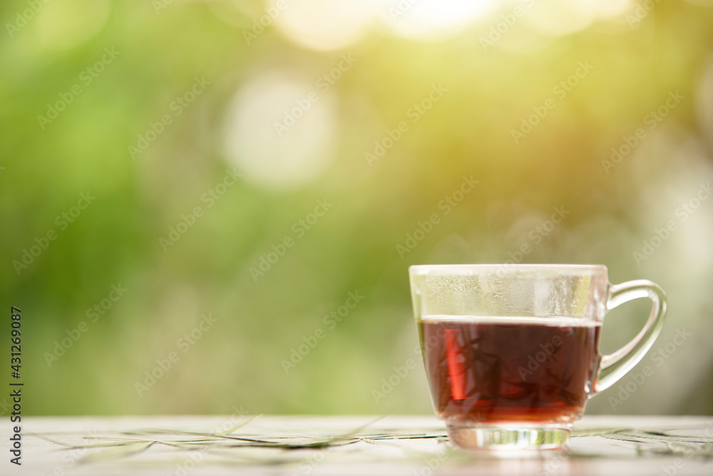 Hot tea on green background Hot tea on green background