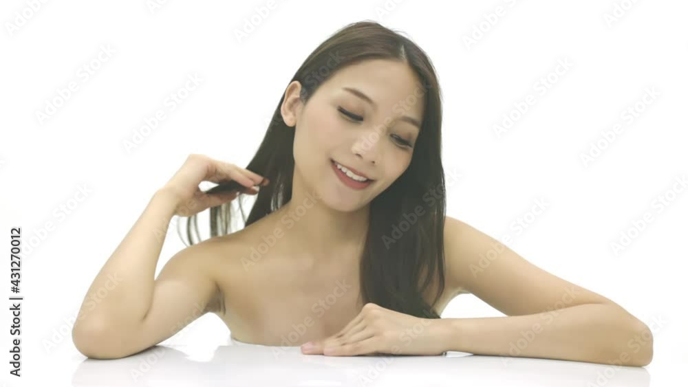 Close up Slow motion Beauty shot of Beautiful Asian woman looking at camera . Close up Slow motion Beauty shot of Beautiful Asian woman looking at camera .