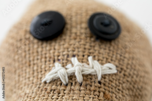 Handmade voodoo doll. Craft and hobby concept. Object on a white background.