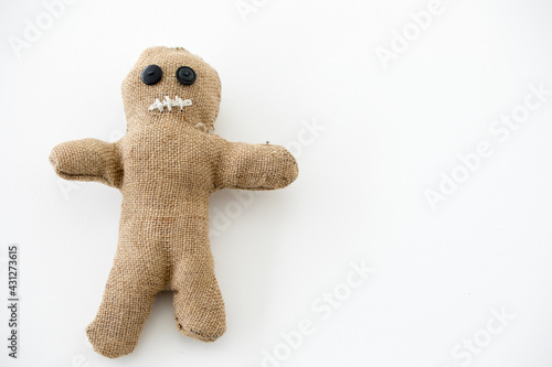 Handmade voodoo doll. Craft and hobby concept. Object on a white background.