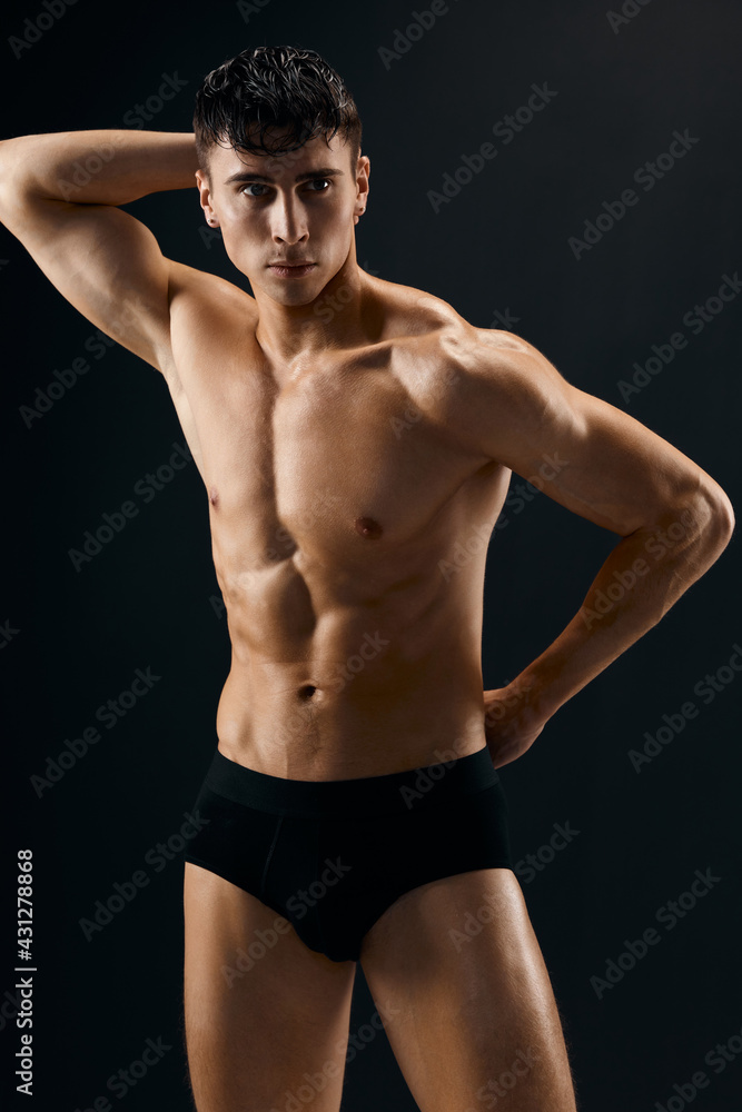 handsome man with muscled naked body in dark panties cropped view studio handsome man with muscled naked body in dark panties cropped view studio