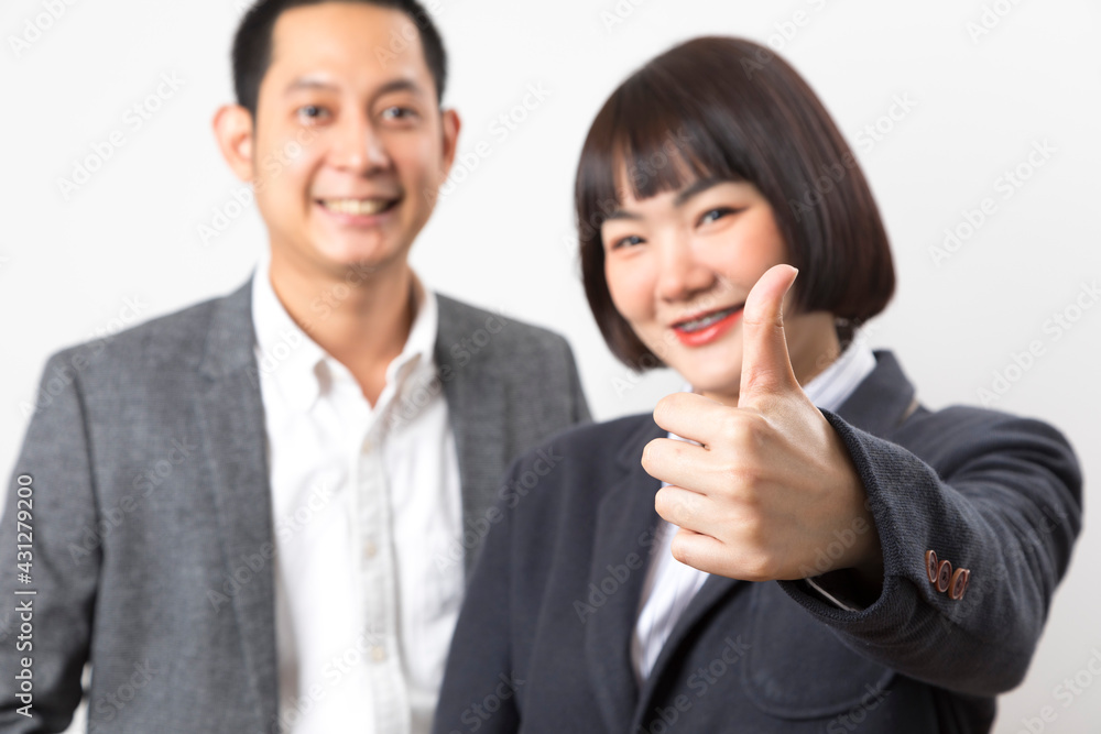 Happy business man and woman showing thumb up over white background. Happy business man and woman showing thumb up over white background.