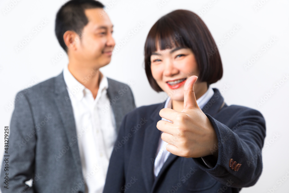 Happy business man and woman showing thumb up over white background. Happy business man and woman showing thumb up over white background.
