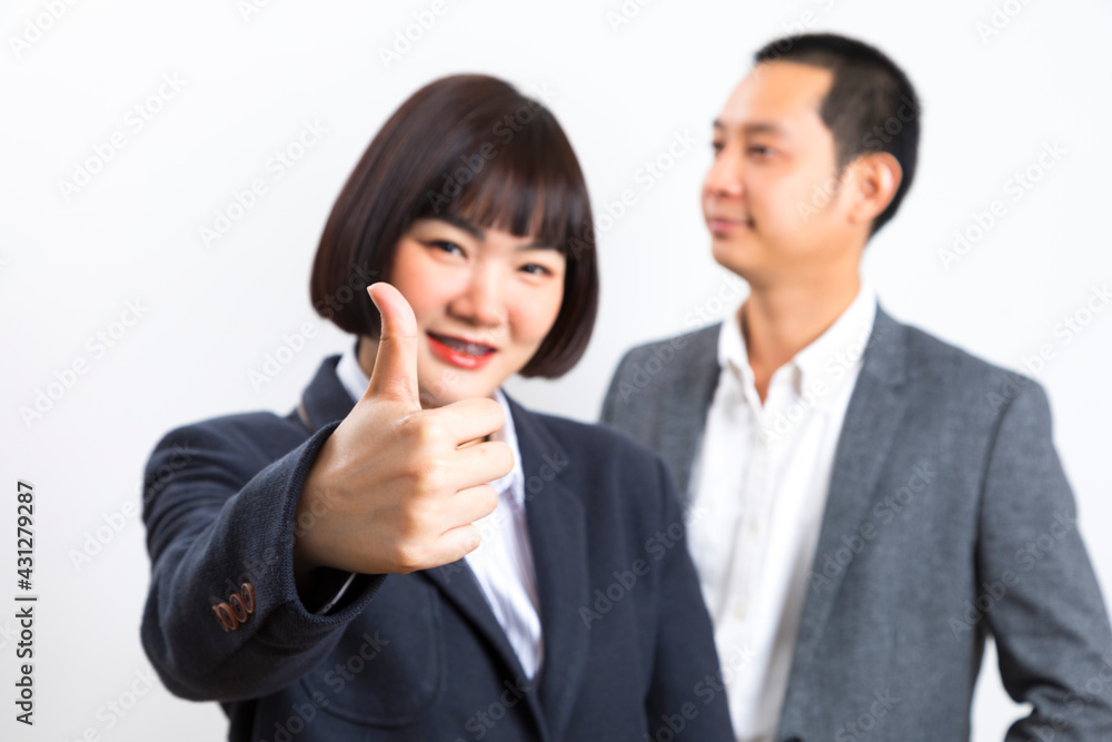 Happy business man and woman showing thumb up over white background. Happy business man and woman showing thumb up over white background.