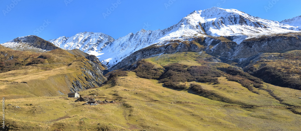 view on alpine mountain with white snowy  range mountain background