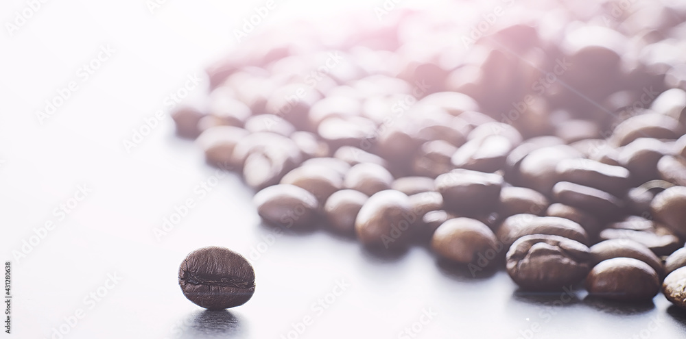 Coffee beans with green leaves for cooking. Bag of coffee. Coffee beans roasted on the table. Coffee beans with green leaves for cooking. Bag of coffee. Coffee beans roasted on the table.