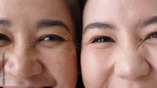 Portrait close up attractive beautiful two asian people half face cheek smile to camera authentic real family mum and adult kid in woman power  diverse people  genes genetics ginger skincare concept.