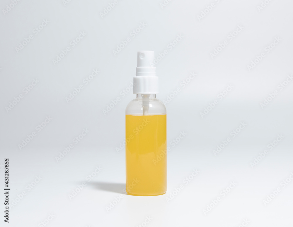 Spray Bottle with yellow liquid