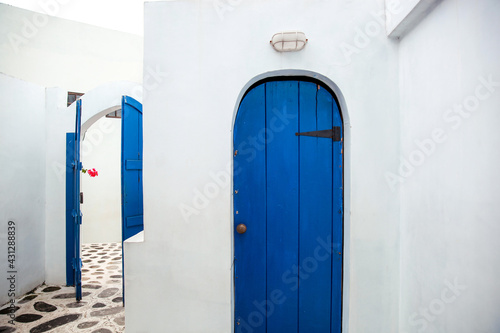 Old wooden blue door of Greece white traditional house Santorini © Gatot