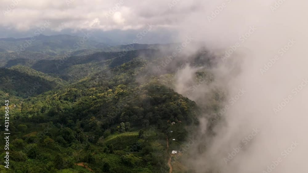 Aerial view of mist, cloud and fog hanging over a lush tropical rain forest mountain with rain cloud cover during the rainy season, Mountain landscape of Doi Suan Ya Luang, Nan province, Thailand
Aerial view of mist, cloud and fog hanging over a lush tropical rain forest mountain with rain cloud cover during the rainy season, Mountain landscape of Doi Suan Ya Luang, Nan province, Thailand