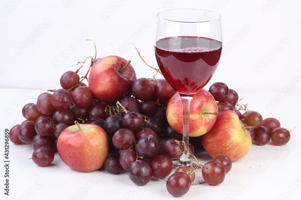 Red wine with fruits on white background