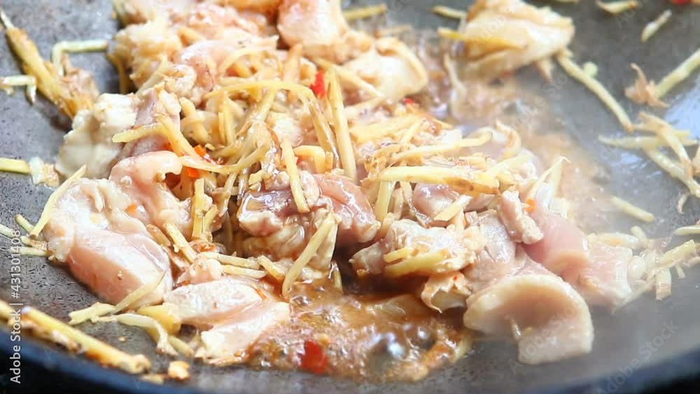 Frying ginger with chicken and mushroom in pan, Chiangmai Thailand Frying ginger with chicken and mushroom in pan, Chiangmai Thailand