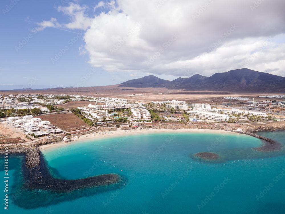 Playa Dorada beach aerial drone shot. Playa Blanca, Lanzarote, Canary Islands