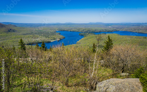 View on lake Stukely and the Eastern TOwnships mountains from the top of Mont Chauve, a mountain located in Mont Orford National Park in Quebec, Canada photo