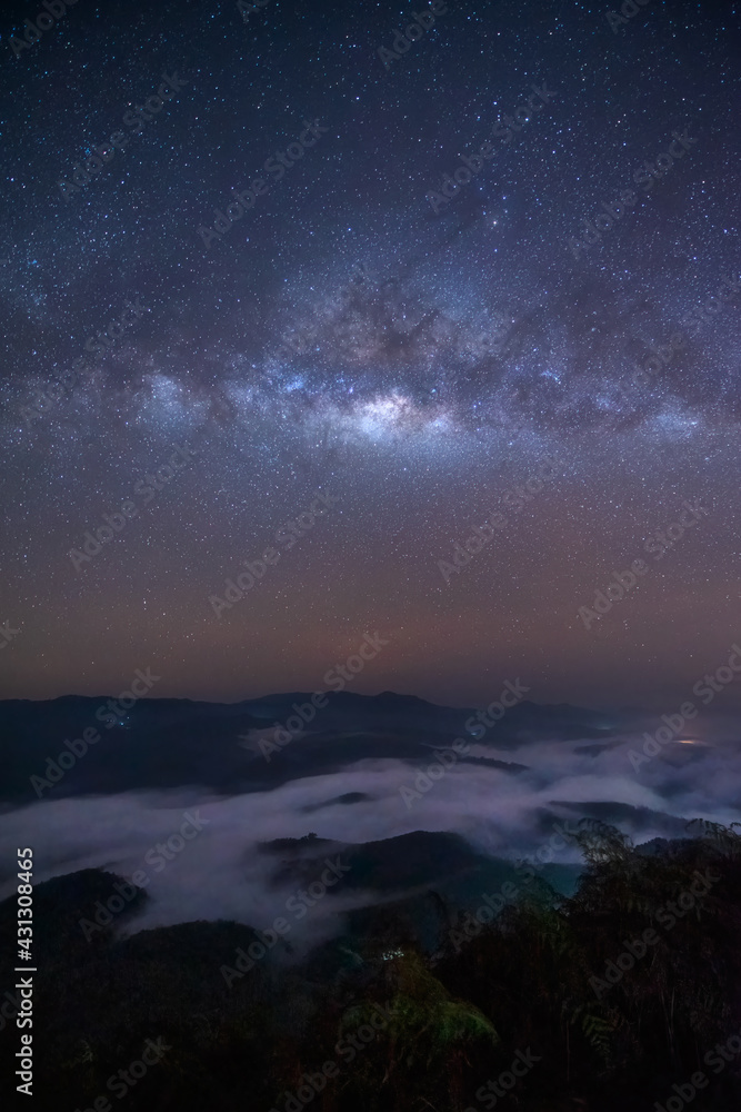 Milky way in the sky with the beautiful view of mountain and mist at night. Taken at Betong in Yala province in Thailand.