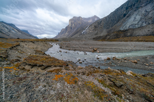 A cloudy  rainy day in remote arctic valley of Akshayuk Pass  Baffin Island  Canada.  Hiking north in remote wilderness.