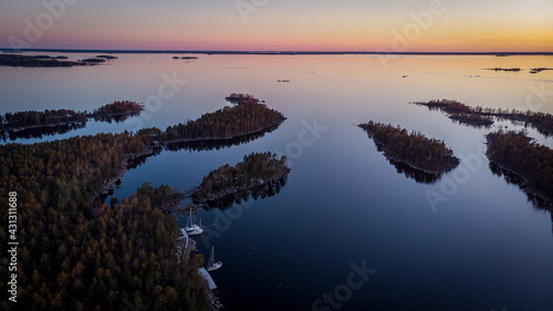 Sailing boats in the evening calm in Kvarken Archipelago, Finland. photo