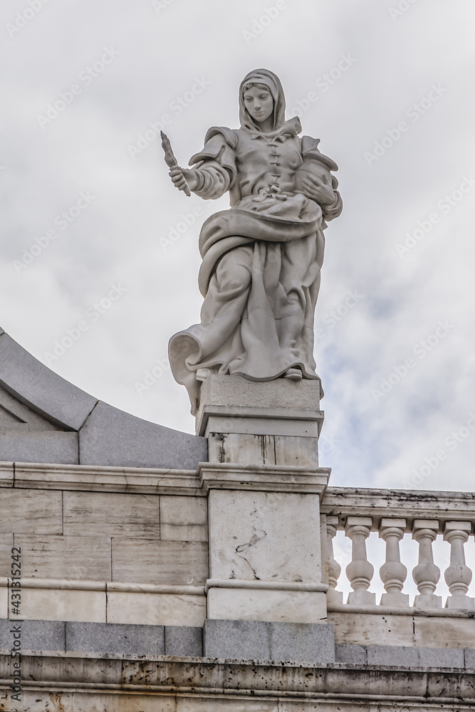 Statues of the main facade of famous Santa Maria la Real de La Almudena - Catholic cathedral in Madrid, Spain.