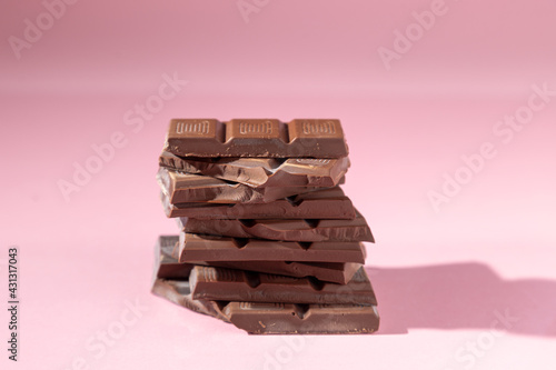 chocolate pieces isolated on pink background