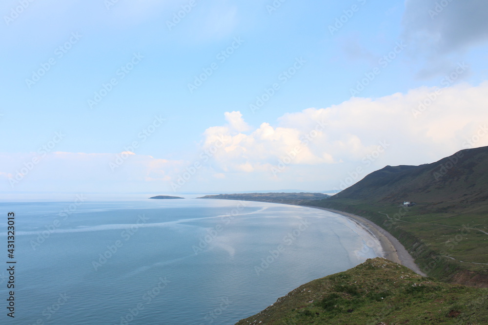 A photograph of the view at Rhossili Bay, on the Gower peninsula, Wales, UK A photograph of the view at Rhossili Bay, on the Gower peninsula, Wales, UK