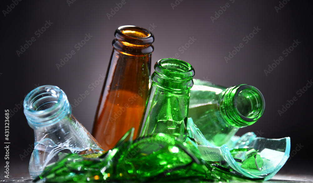 Broken glass bottles and pieces of glass. Recycling. Stock Photo