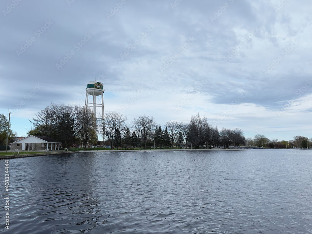 A water tower on a lake A water tower on a lake
