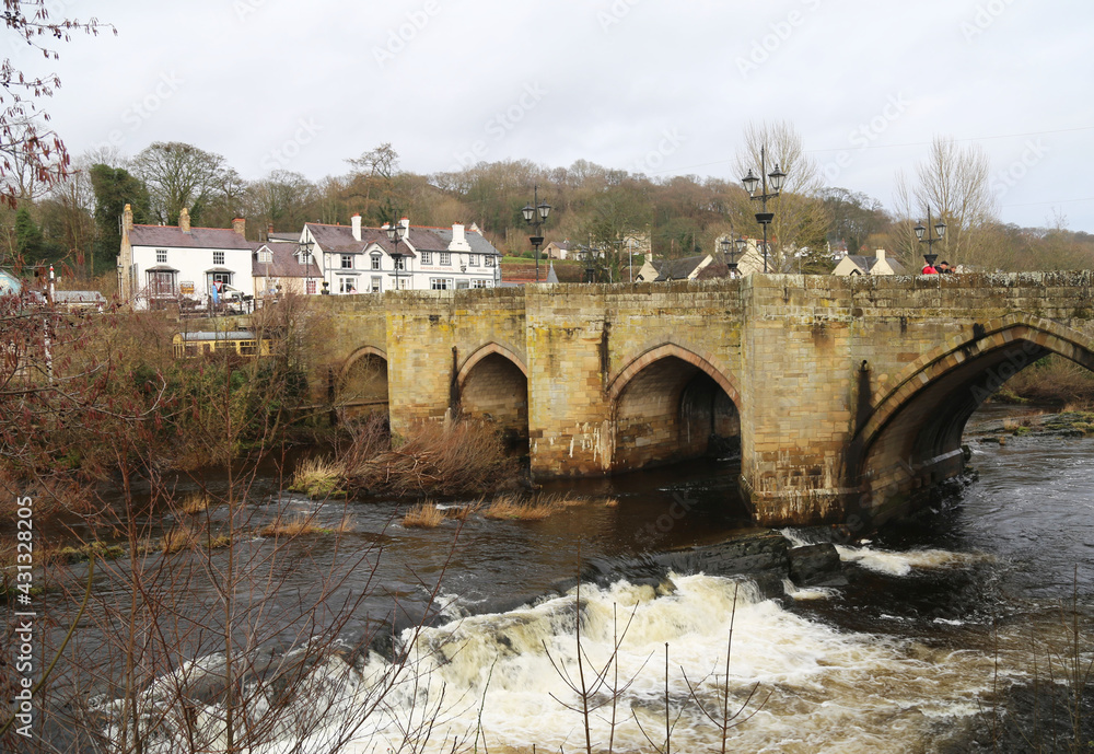 The historical arched bridge across the River Dee in Llangollen, Denbighshire, Wales, UK.