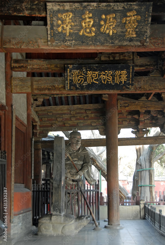 Jinci Temple near Taiyuan, Shanxi , China. A fearsome statue and Chinese characters at the front of Shengmu Hall or Holy Mother Hall, the earliest existing main hall of Jinci Temple. Jinci Temple near Taiyuan, Shanxi , China. A fearsome statue and Chinese characters at the front of Shengmu Hall or Holy Mother Hall, the earliest existing main hall of Jinci Temple.
