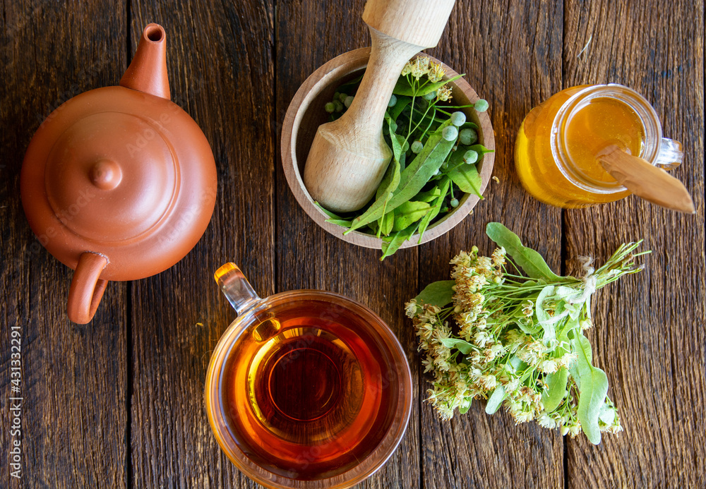 cup of herbal Linden tea with fresh linden flowers flowers background, treatment and prevention of immune concept
cup of herbal Linden tea with fresh linden flowers flowers background, treatment and prevention of immune concept