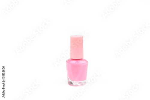 Nail polish small glass bottle. Unbranded mockup of pink nailpolish isolated on white background with copy space. Professional manicure concept.