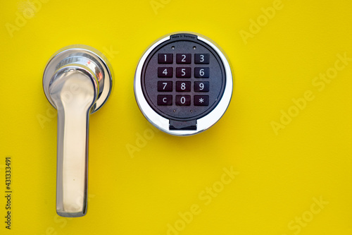Secure vault with number based padlock security mechanism keyboard as safeguard for treasures and encryption symbol to protect data and secrets in steel against cyber crime and burglary attacks