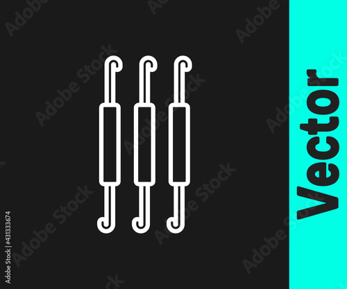 White line Crochet hook icon isolated on black background. Knitting hook. Vector