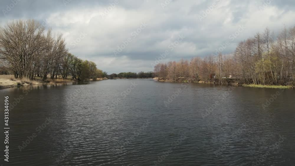 camera movement along the river in spring. aerial shooting camera movement along the river in spring. aerial shooting
