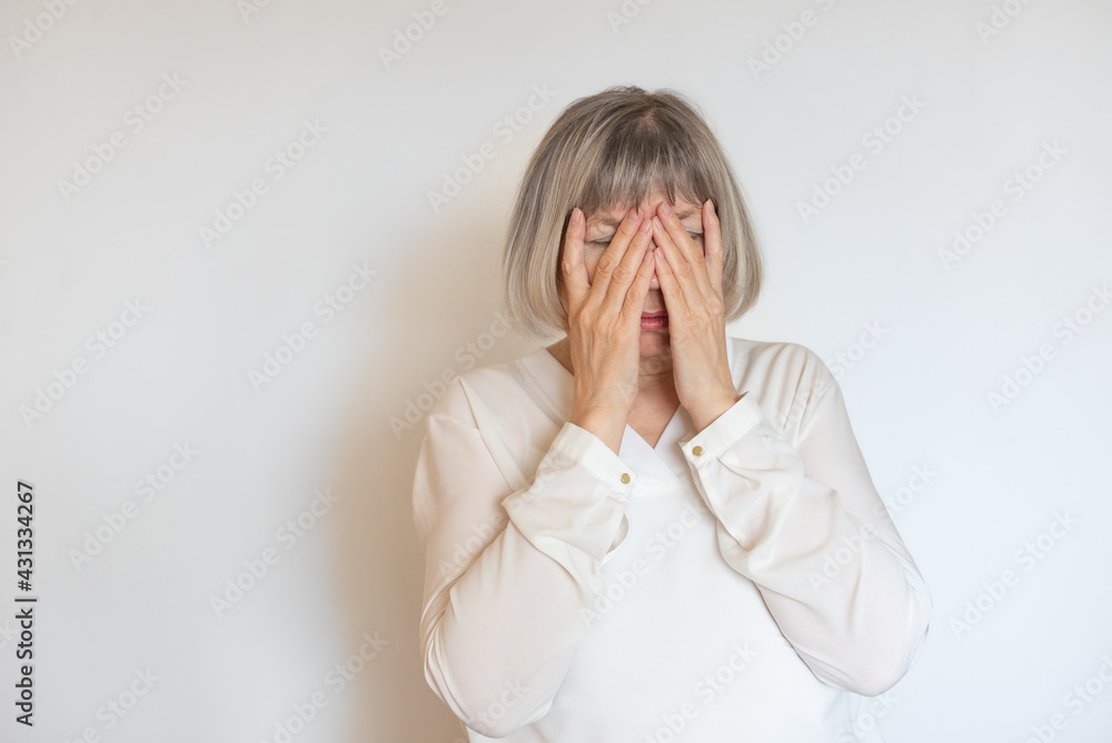 Senior woman stress addict and alcoholism. Tired lady loneliness and pain. Alone, depression covered her face with her hands crying. Headache, dizziness, migraine. Social documentary concepts. Senior woman stress addict and alcoholism. Tired lady loneliness and pain. Alone, depression covered her face with her hands crying. Headache, dizziness, migraine. Social documentary concepts.