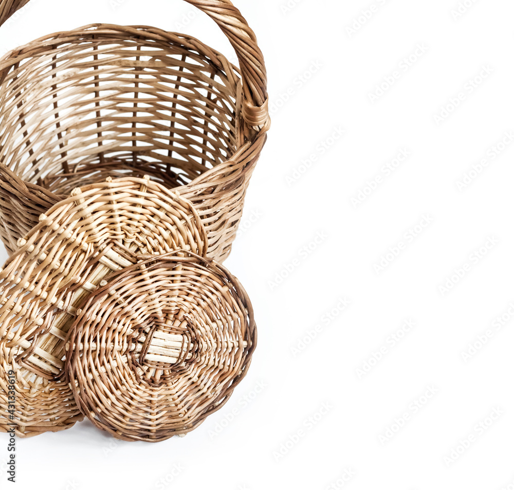 Fototapeta premium Wicker basket and bottoms for baskets isolated on white background