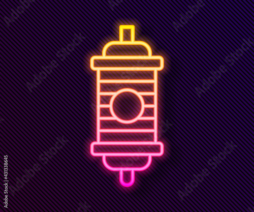 Glowing neon line Chinese paper lantern icon isolated on black background. Vector