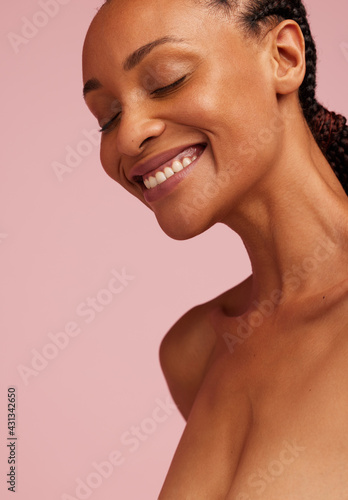 Smiling african woman with healthy skin