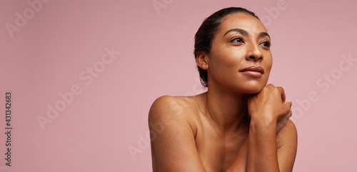 Pretty woman with healthy skin looking away