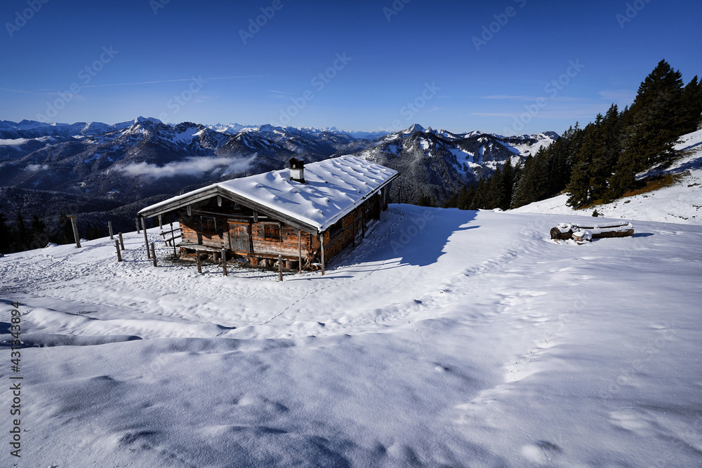 Wonderful wooden hut in snow covered mountains