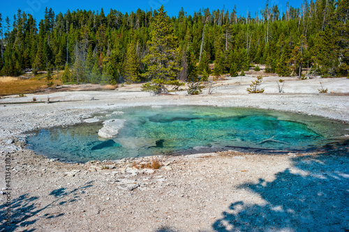 Deep azure thermal spring by in Yellowstone National Park
