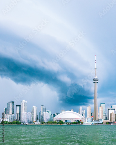 Photography Storm clouds gather over downtown Toronto’s skyline seen from on the water of the Inner Harbour